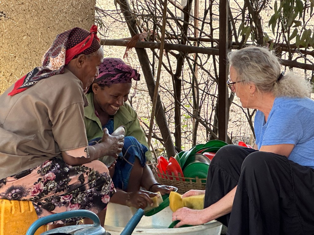ACTS volunteers and community members working together in Ethiopia